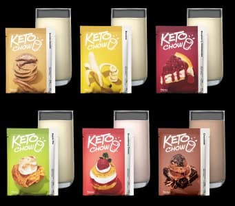 Six Keto Chow single-meal packets arranged in two rows, each paired with a glass of prepared shake. Flavors include Snickerdoodle, Banana, Raspberry Cheesecake, Apple Pie, Strawberry Cream, and Chocolate. Each colorful packet features a graphic of the flavor inspiration, such as cookies, fruit, or cake, against a white background.