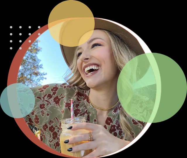 Smiling lady drinking milkshake
