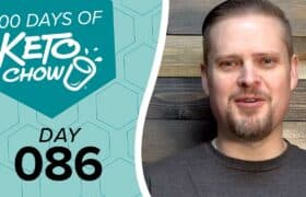 A man smiles next to a teal graphic with 100 DAYS OF KETO CHOW text, a stylized cup logo, and DAY 086.