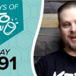 Promotional image for Keto Chow. Left side features a teal honeycomb pattern background with text 100 DAYS OF KETO CHOW, a Keto Chow cup logo, and DAY 091. Right side shows a man in a black shirt.
