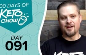Promotional image for Keto Chow. Left side features a teal honeycomb pattern background with text 100 DAYS OF KETO CHOW, a Keto Chow cup logo, and DAY 091. Right side shows a man in a black shirt.
