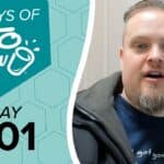 Teal and white graphic featuring 100 DAYS OF KETO CHOW with a cup logo and splash, over a hexagonal pattern. Black text below says DAY 001.