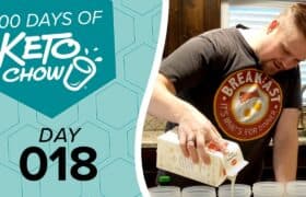 Man in a Breakfast t-shirt pouring heavy whipping cream from a white carton. Left panel shows 100 DAYS OF KETO CHOW logo on a teal background with DAY 018 text.