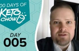 Teal graphic with 100 DAYS OF KETO CHOW logo and text DAY 005 next to a man with a goatee in a suit.