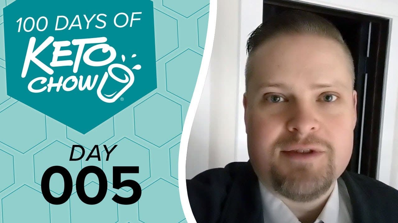 Teal graphic with 100 DAYS OF KETO CHOW logo and text DAY 005 next to a man with a goatee in a suit.