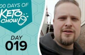 Graphic: 100 DAYS OF KETO CHOW logo, DAY 019 text, on teal and light blue-green hexagons. Right side shows a man.