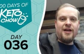 Teal graphic: 100 DAYS OF KETO CHOW with blender cup logo, text DAY 036. Right, a man speaking, wearing a gray jacket.