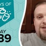 Graphic with 100 DAYS OF KETO CHOW and DAY 039 text on a teal and light blue hexagonal background, beside a man in a grey shirt.