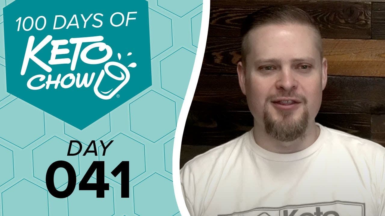Teal graphic features white text 100 DAYS OF KETO CHOW, Keto Chow logo splash design, and black text DAY 041. A man with a goatee smiles on the right.