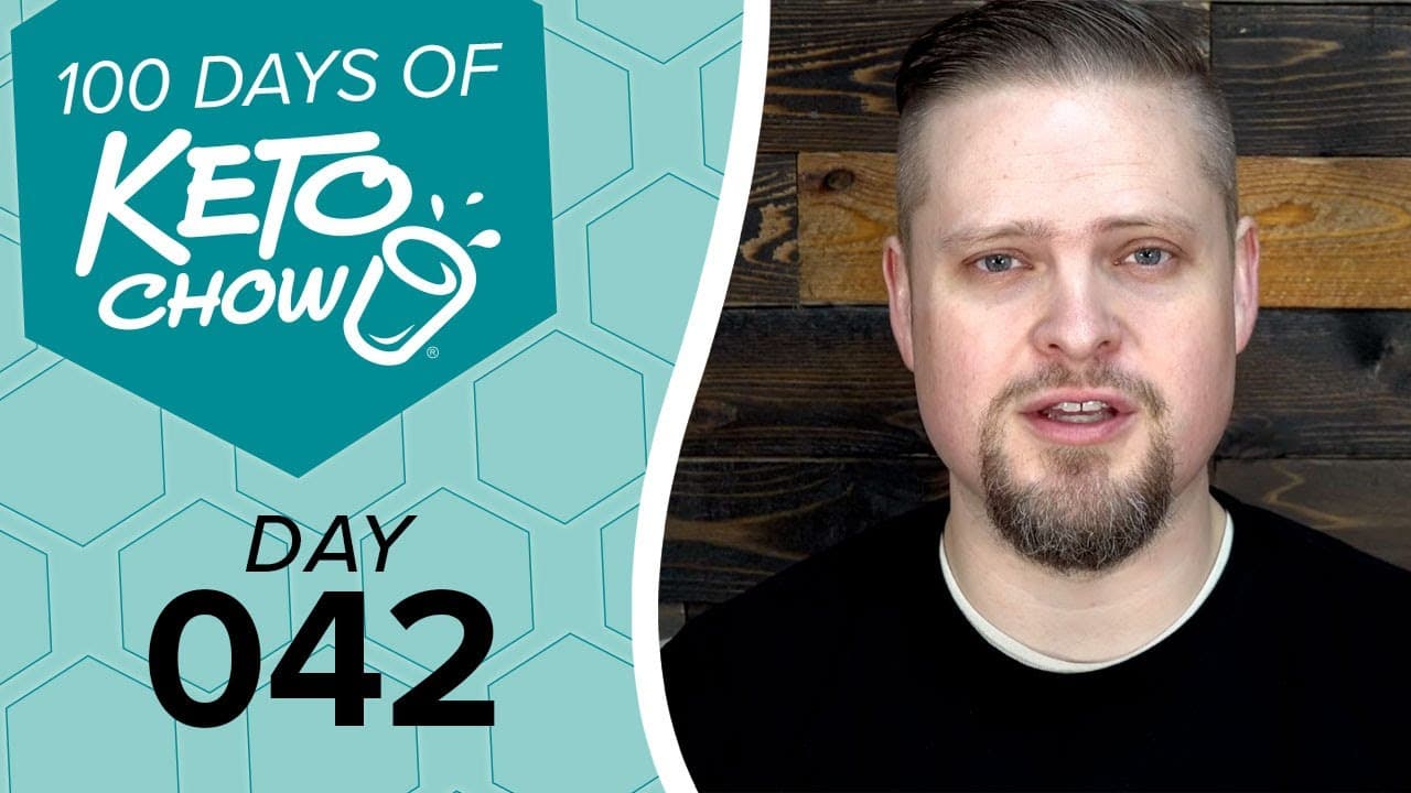 KETO CHOW logo and text 100 DAYS OF KETO CHOW and DAY 042 on a teal hexagonal graphic. A man with a beard is on the right.
