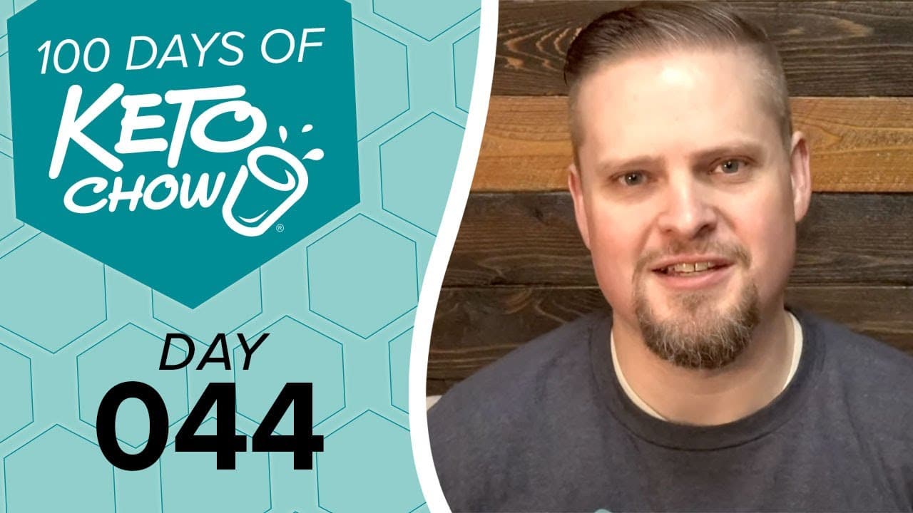 Keto Chow brand graphic. 100 DAYS OF KETO CHOW text with shaker cup logo on teal honeycomb background. Text DAY 044. Man on right.