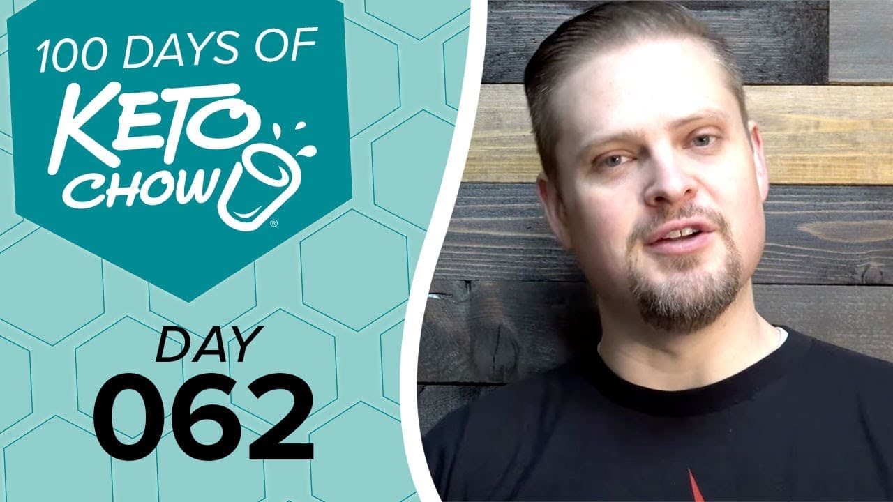 Teal graphic with 100 DAYS OF KETO CHOW logo and text DAY 062. A man in a black shirt is on the right with a wooden background.