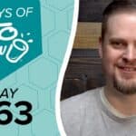 Digital graphic for KETO CHOW with a teal honeycomb background. Text reads 100 DAYS OF KETO CHOW and DAY 063. A man with a beard smiles on the right.