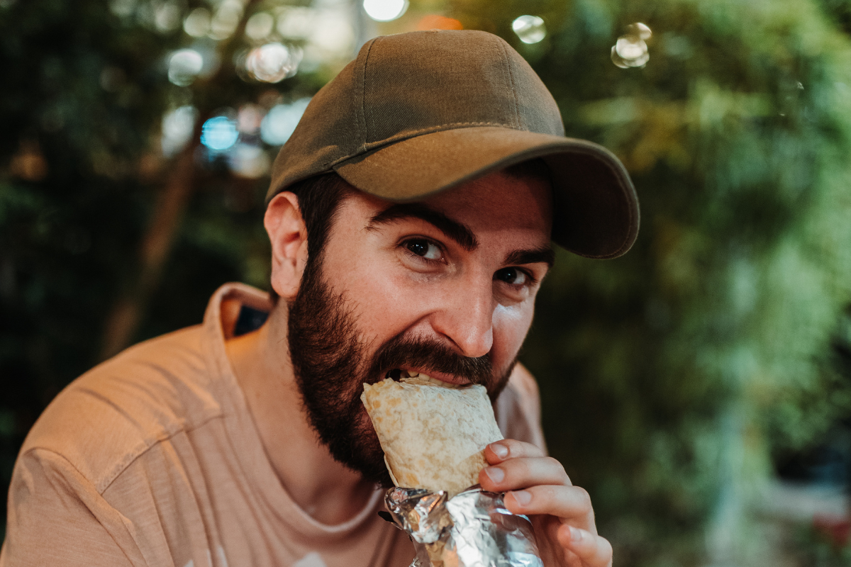 man eating burrito