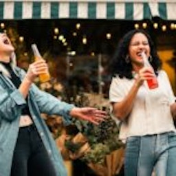 women holding soda