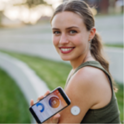 woman wearing cgm device