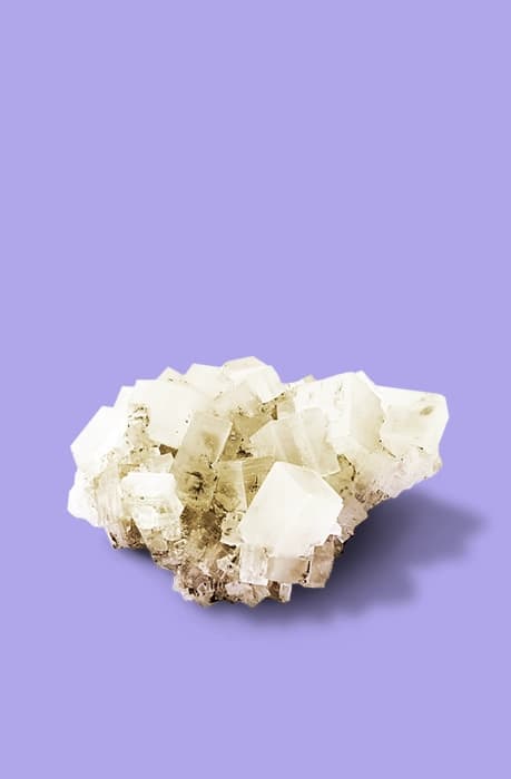 A salt crystal on a purple background