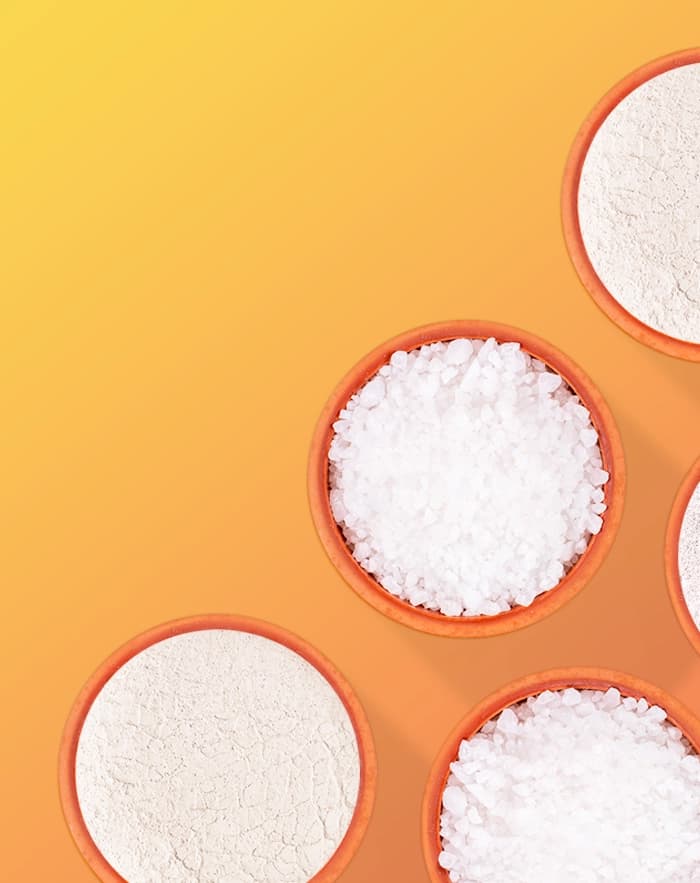 Overhead view of bowls of white granular material