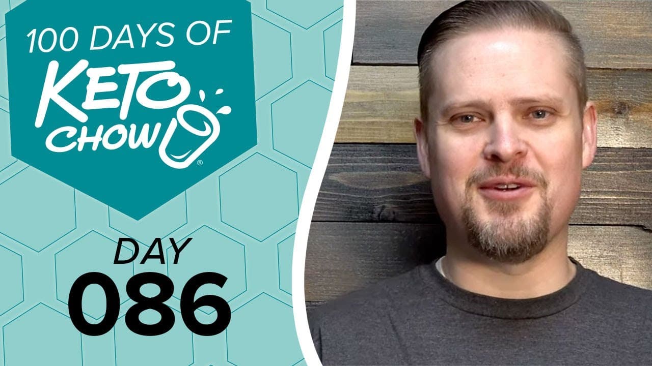 A man smiles next to a teal graphic with 100 DAYS OF KETO CHOW text, a stylized cup logo, and DAY 086.