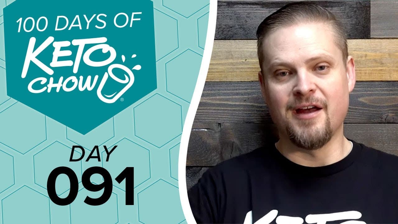 Promotional image for Keto Chow. Left side features a teal honeycomb pattern background with text 100 DAYS OF KETO CHOW, a Keto Chow cup logo, and DAY 091. Right side shows a man in a black shirt.