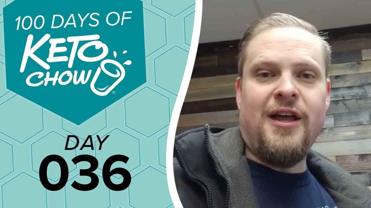 Teal graphic: 100 DAYS OF KETO CHOW with blender cup logo, text DAY 036. Right, a man speaking, wearing a gray jacket.