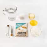 Ingredients for Hot Buttered Spiced Apple Tea; water, tea bag, Keto Chow, spices, butter, a lemon, and some cream.