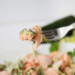 Close up of Salmon and zucchini noodles on a fork