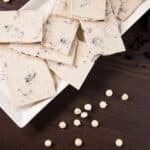 White plate with cookies and cream bark, top view