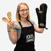 Keto Chow label on bamboo cooking utentils, an oven mit, and on an aprin